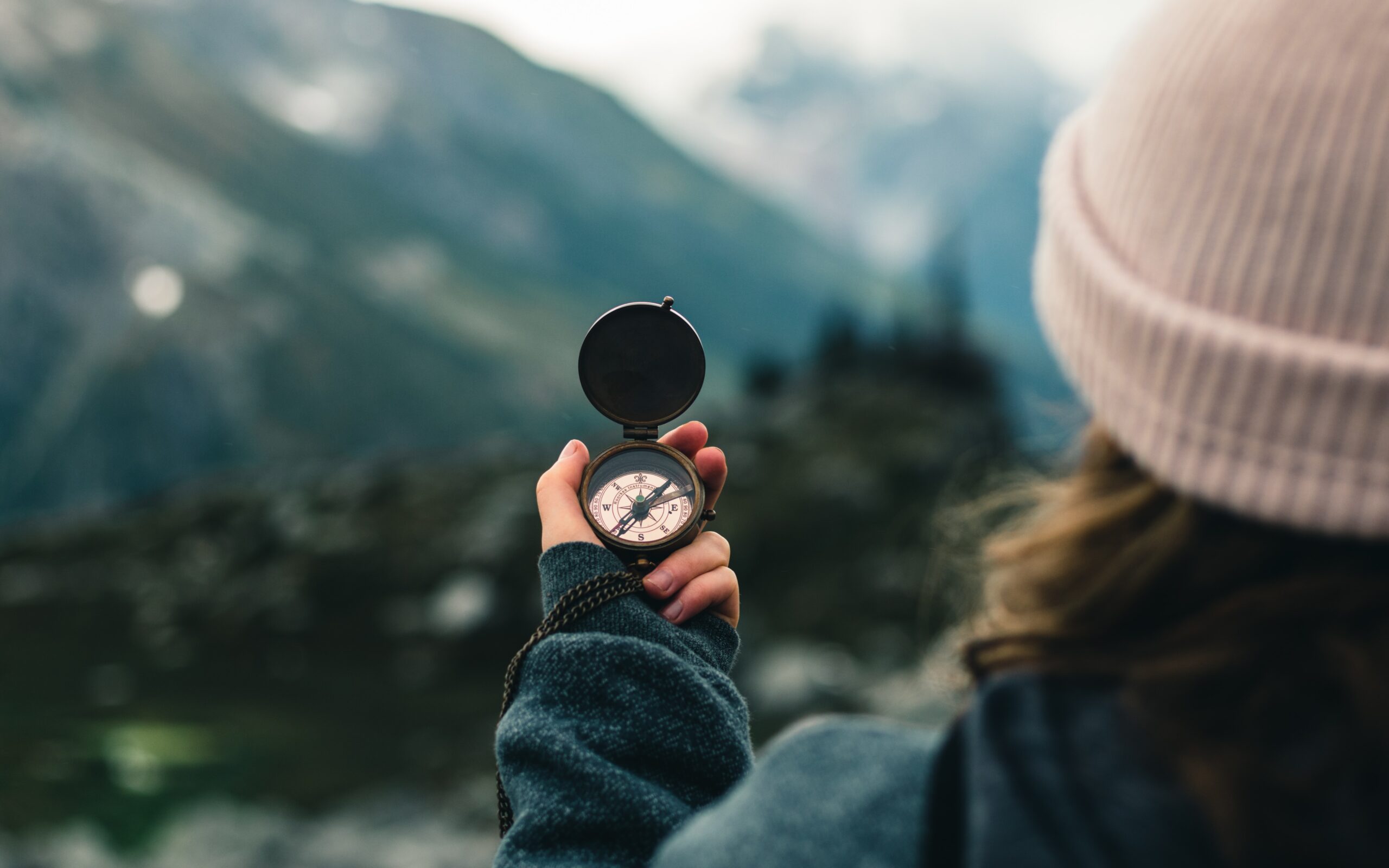 woman holding compass